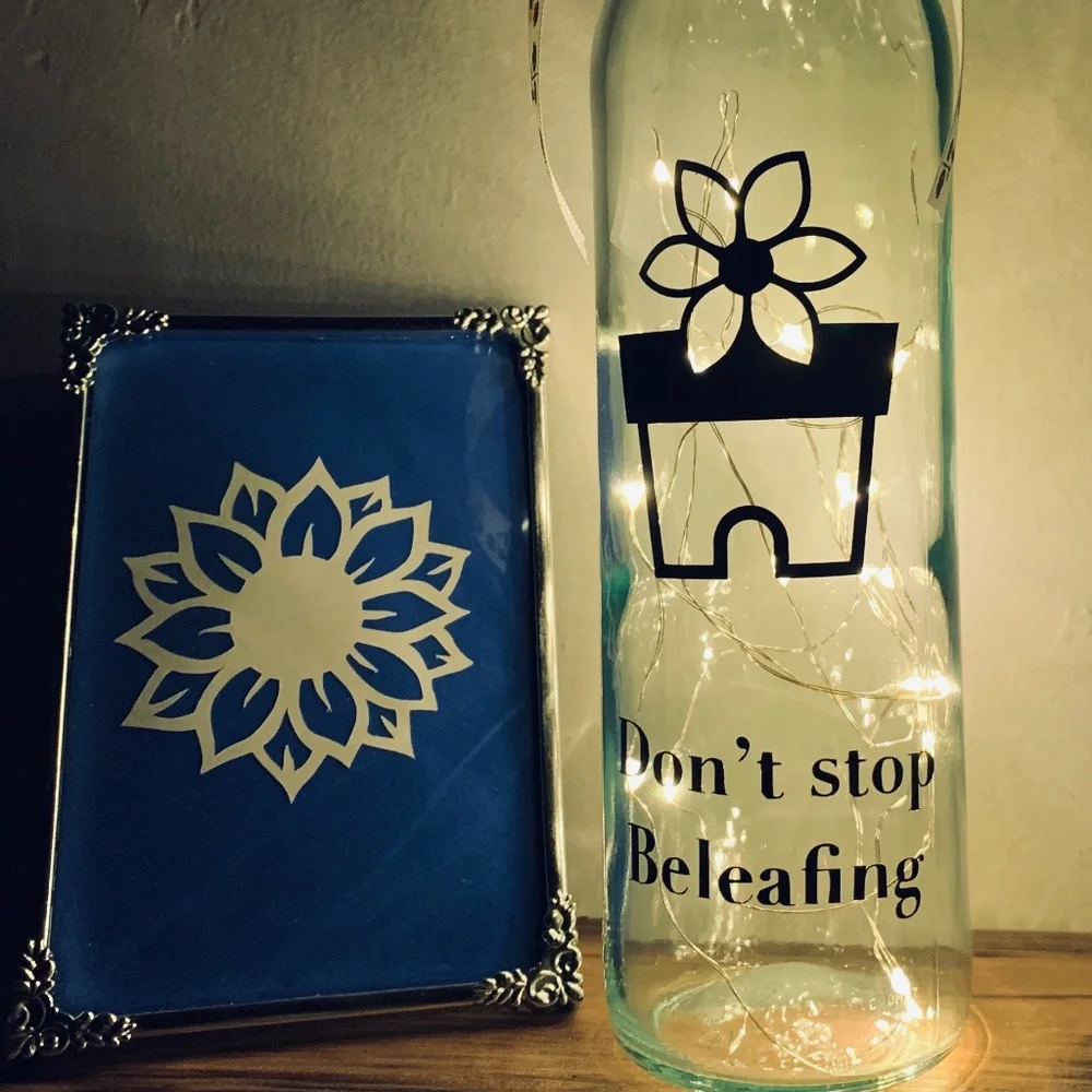 ‘Don’t Stop Beleafing’ logo wine bottle lantern